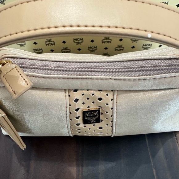 MCM Mini Top Handle Bag
Champagne Monogram Leather - Picture 14 of 15